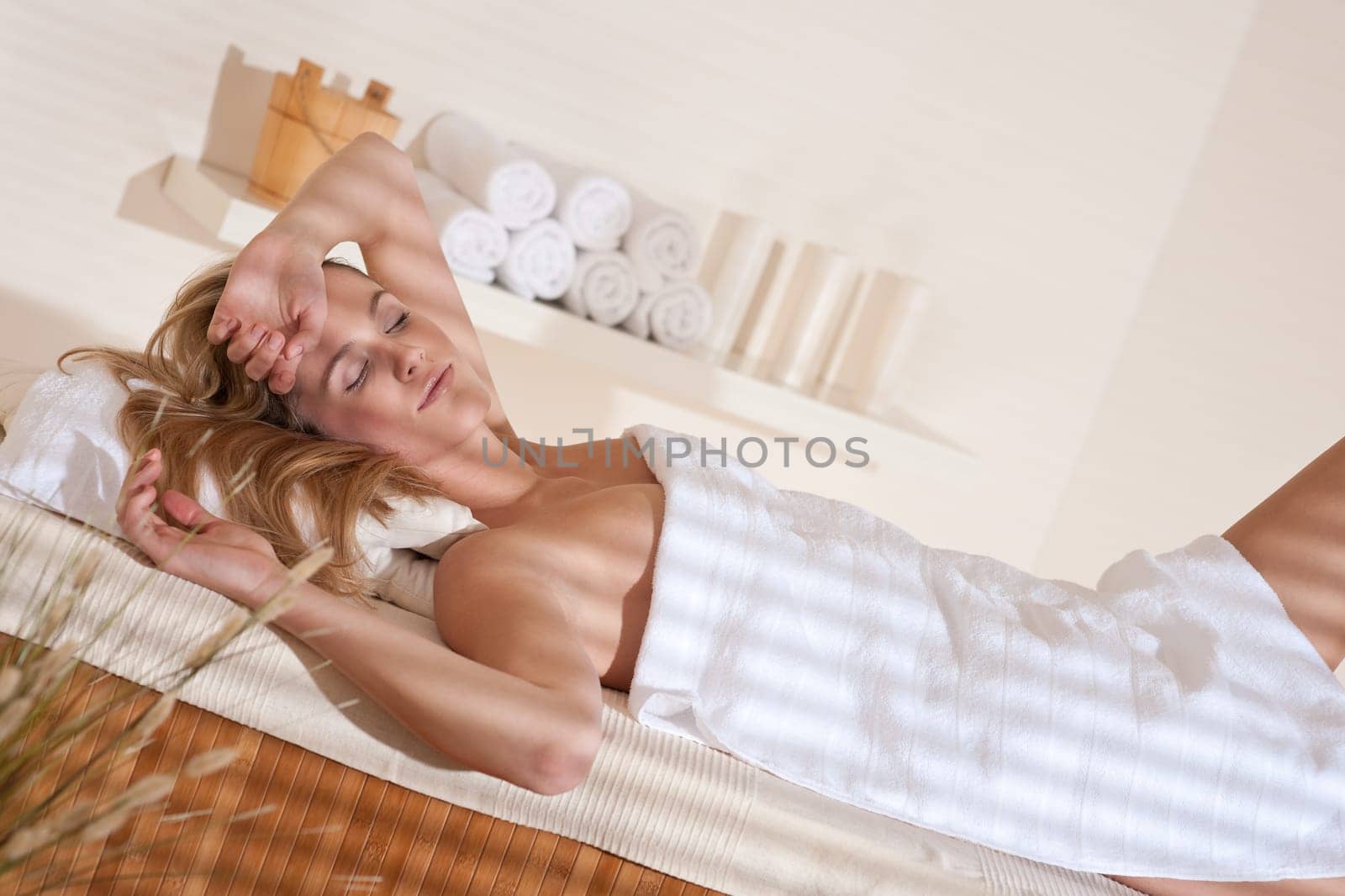 Spa - Young female client at wellness massage