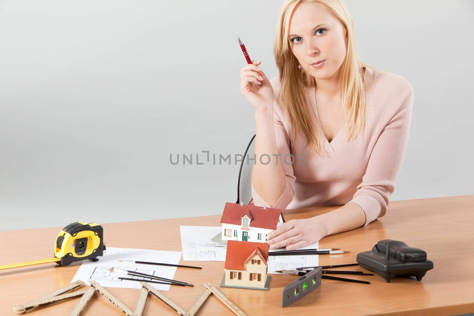 woman architect at her work table