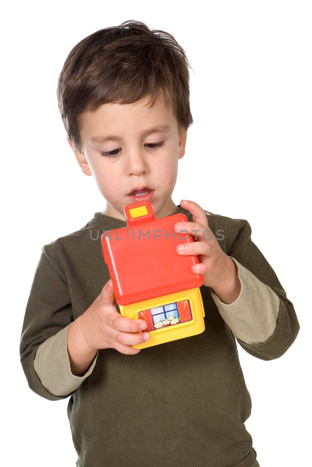 Adorable boy playing with a yellow house