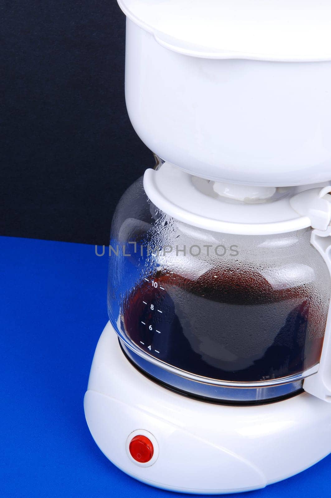 Closeup of white coffee maker.