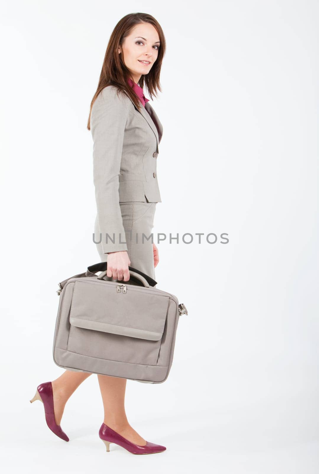 business woman walking with case