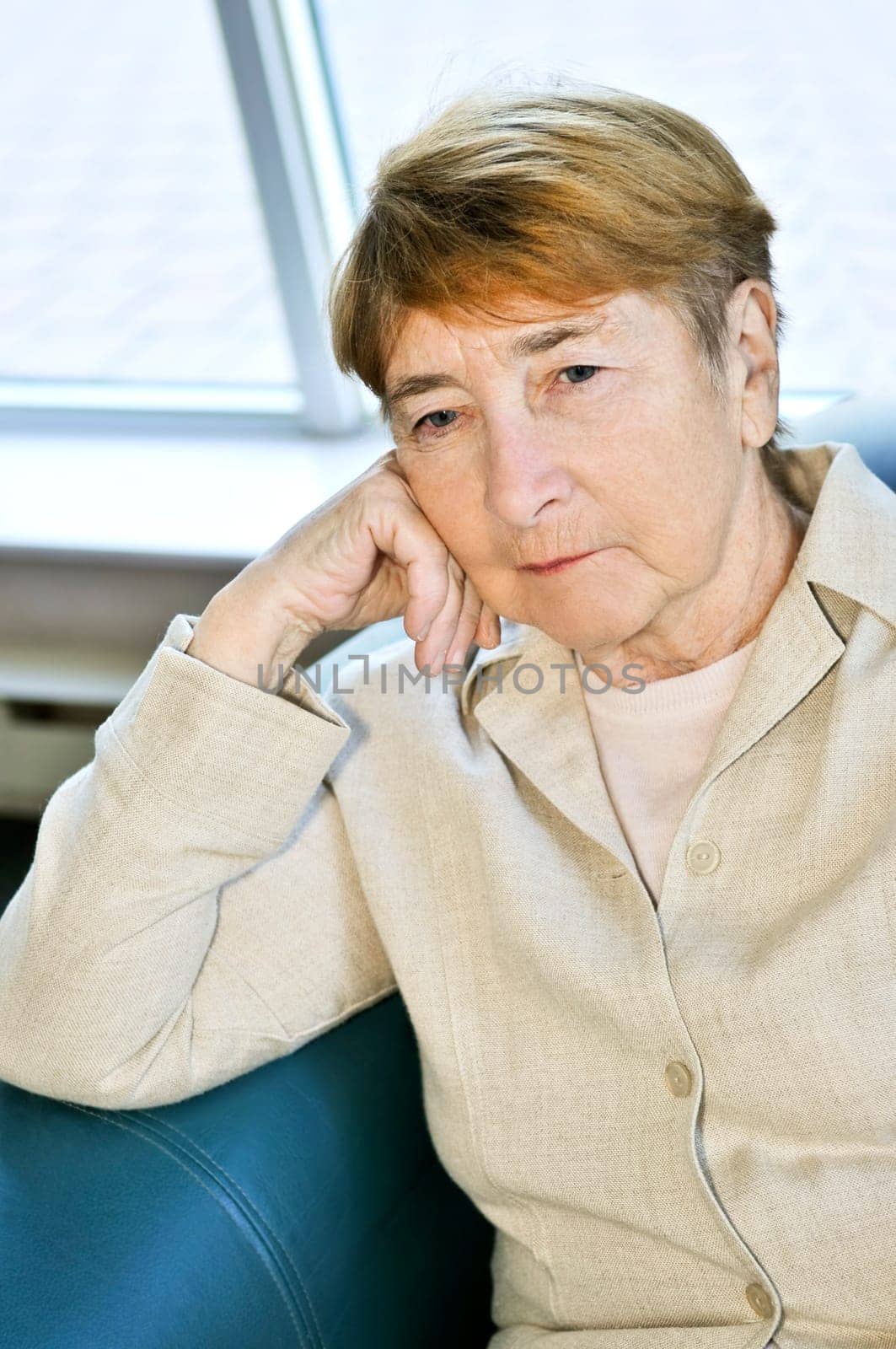 Sad elderly woman