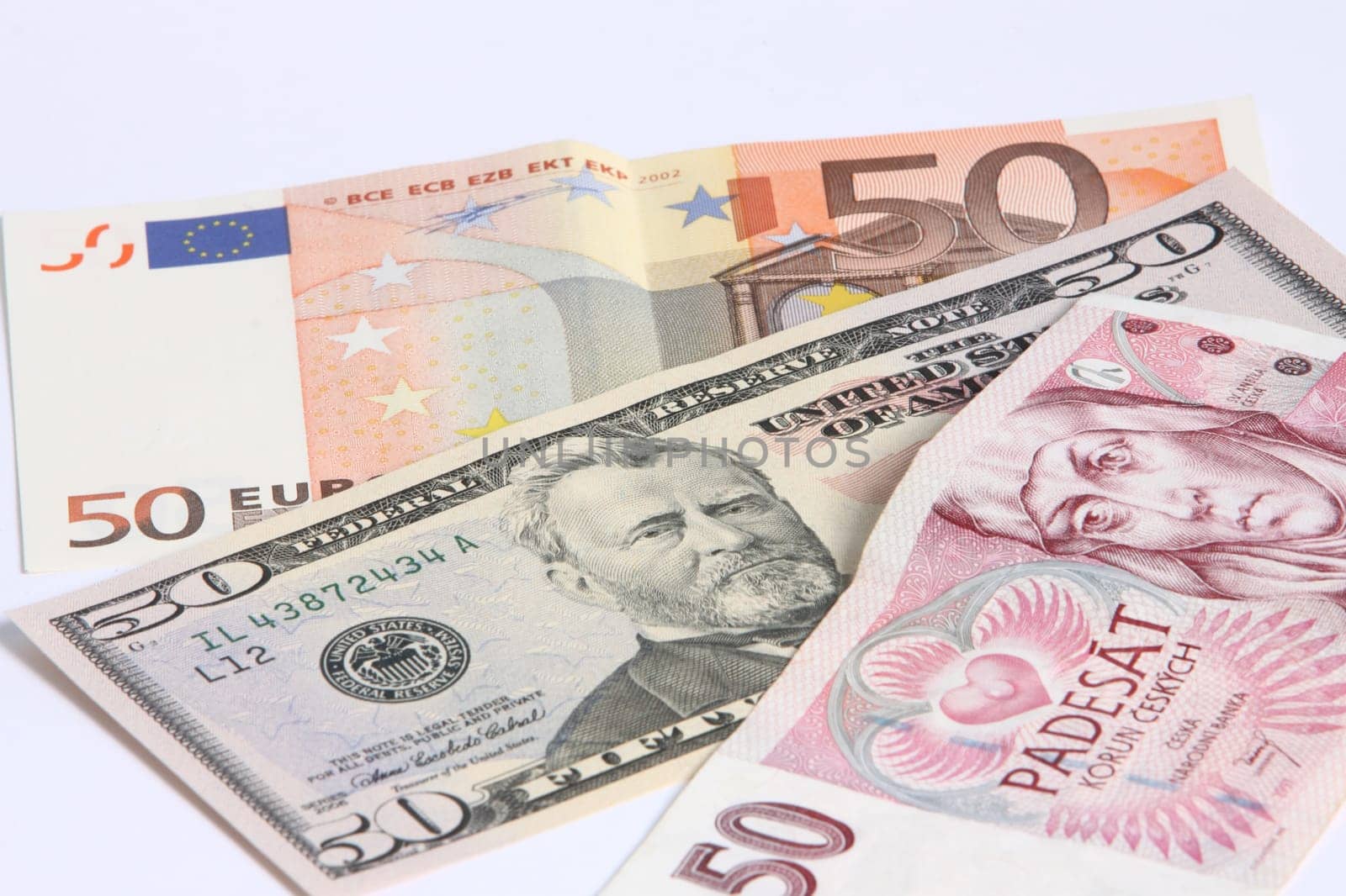 paper moneys - 50 dollar,  50 euro and 50 Korun on white background