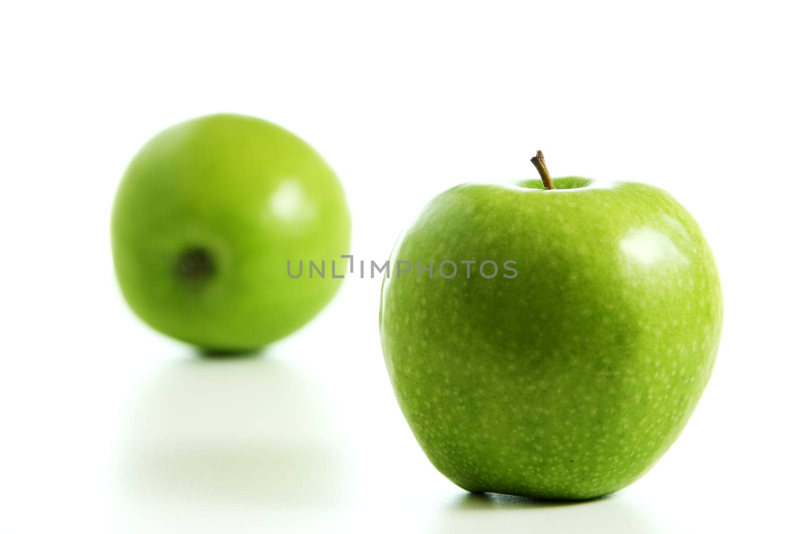 Two fresh green apples