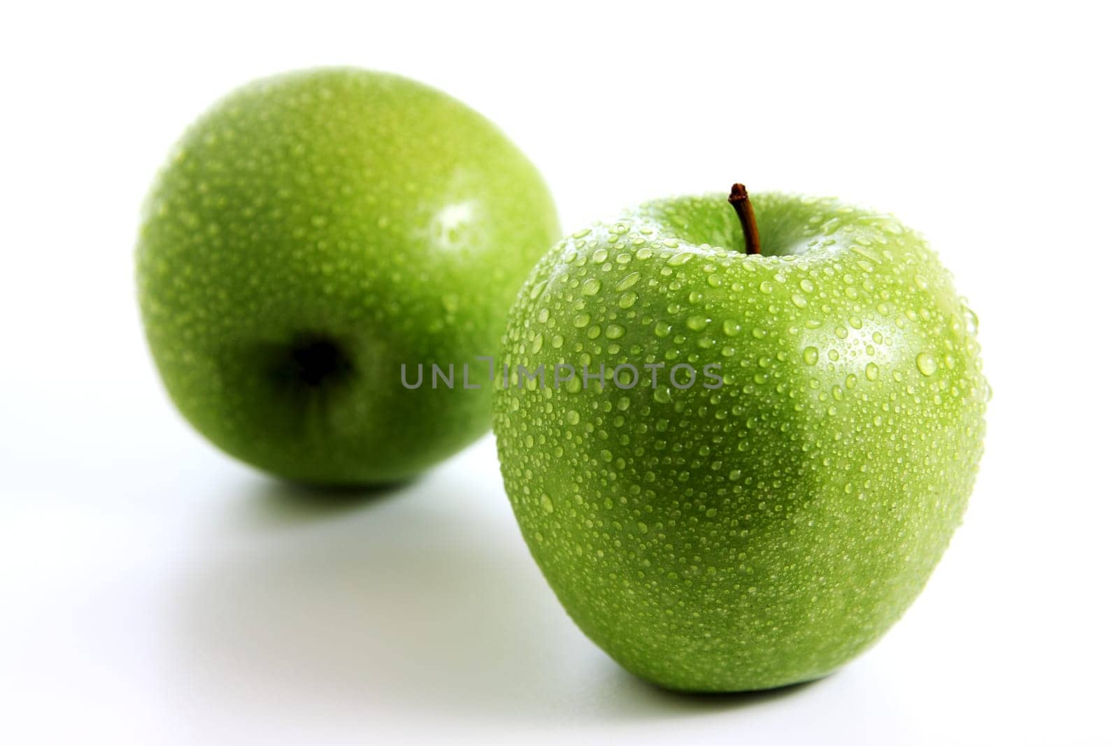 Two fresh green apples