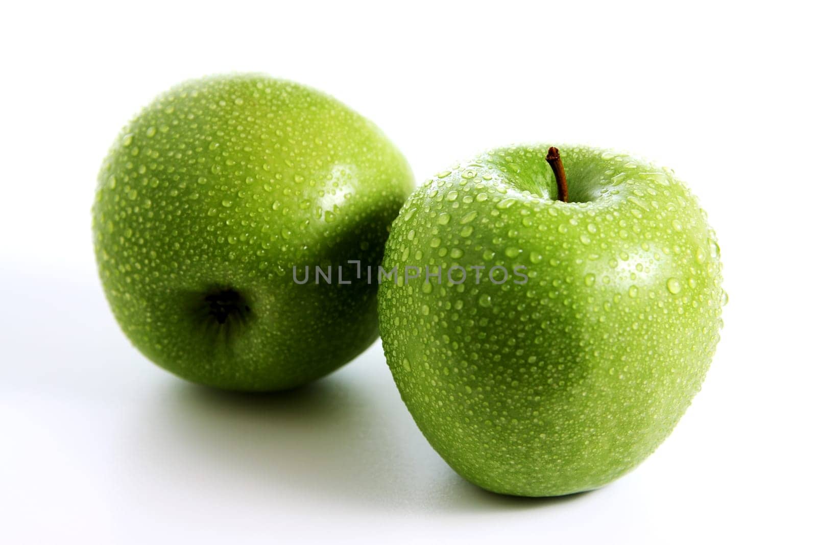 Two fresh green apples