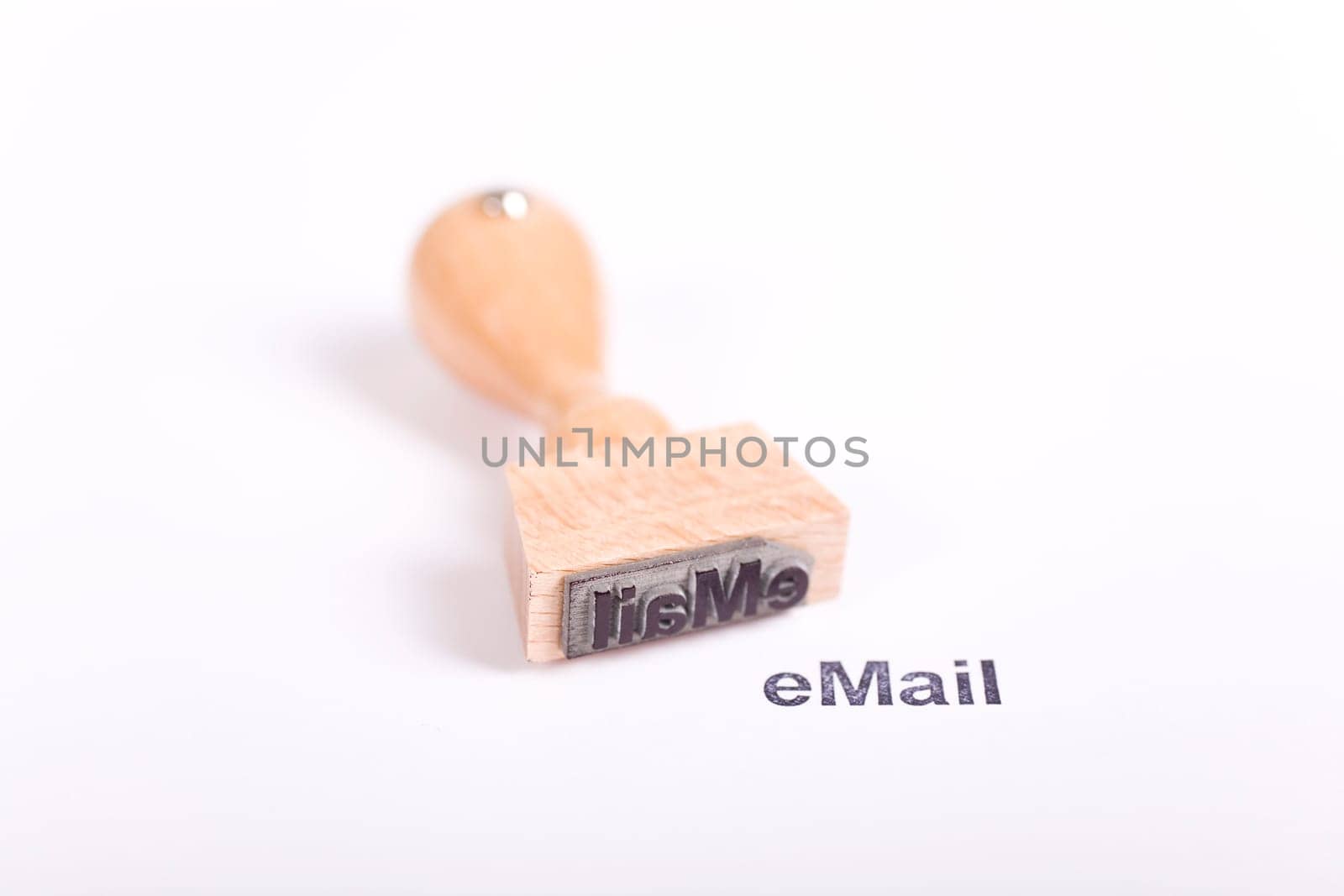 Wooden stamp with the word eMail