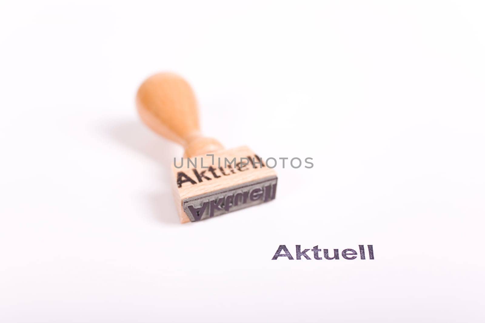 Wooden stamp with the word Current