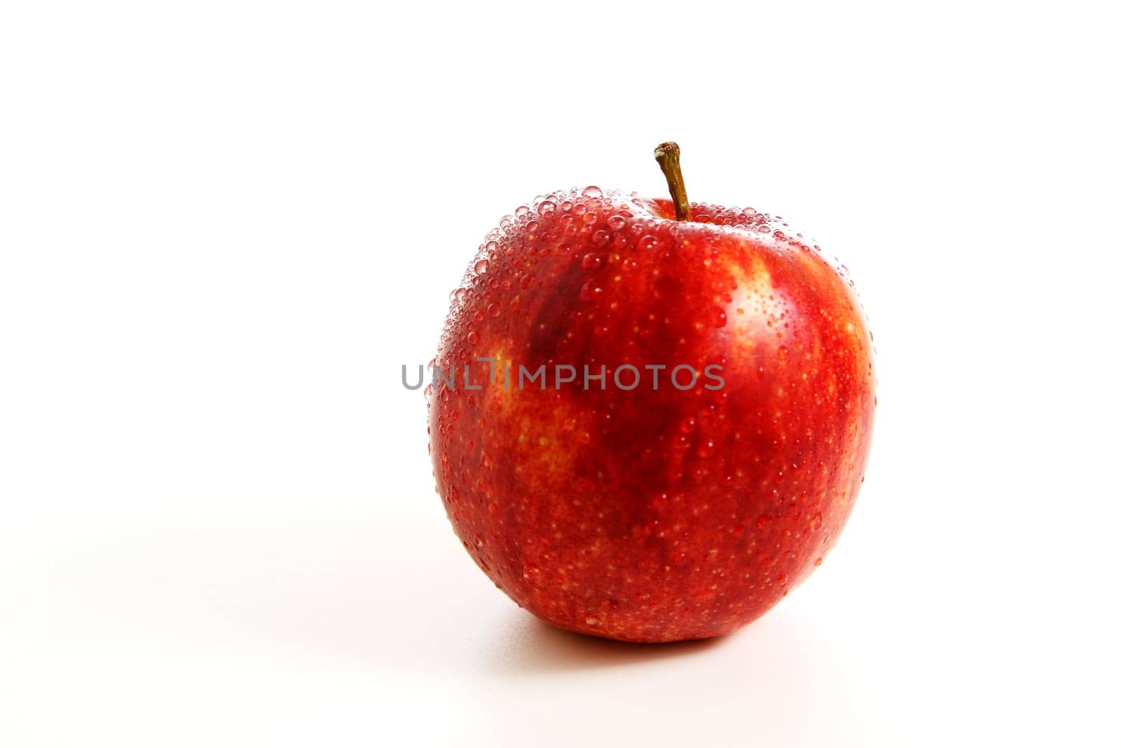 Fresh red apple with water drops