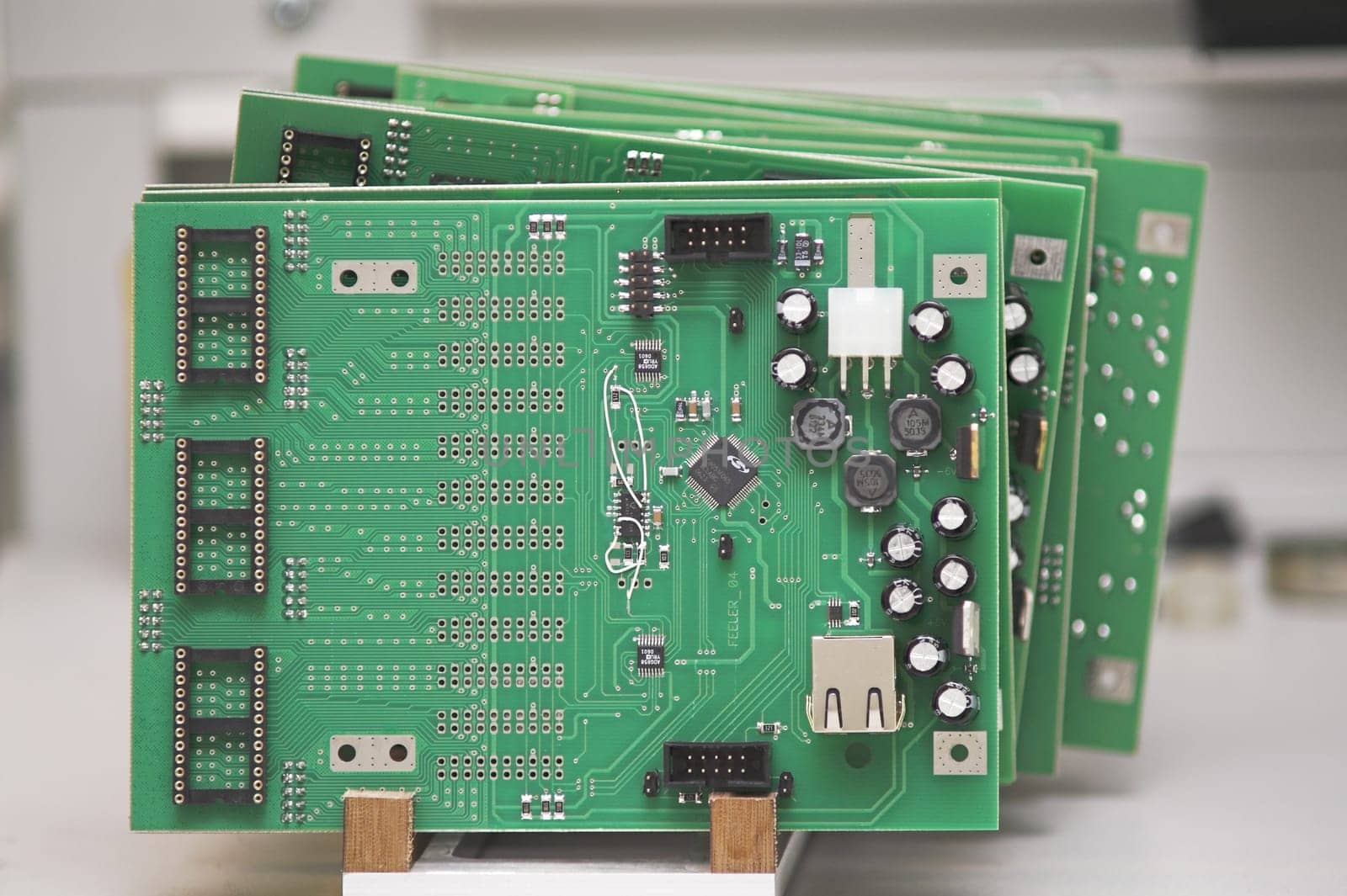Integrated Circuits in a cradle on a table.