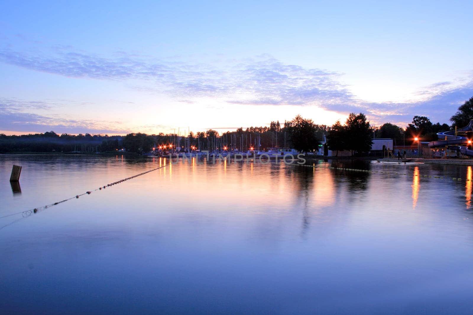 Lake and a marina during the sunset