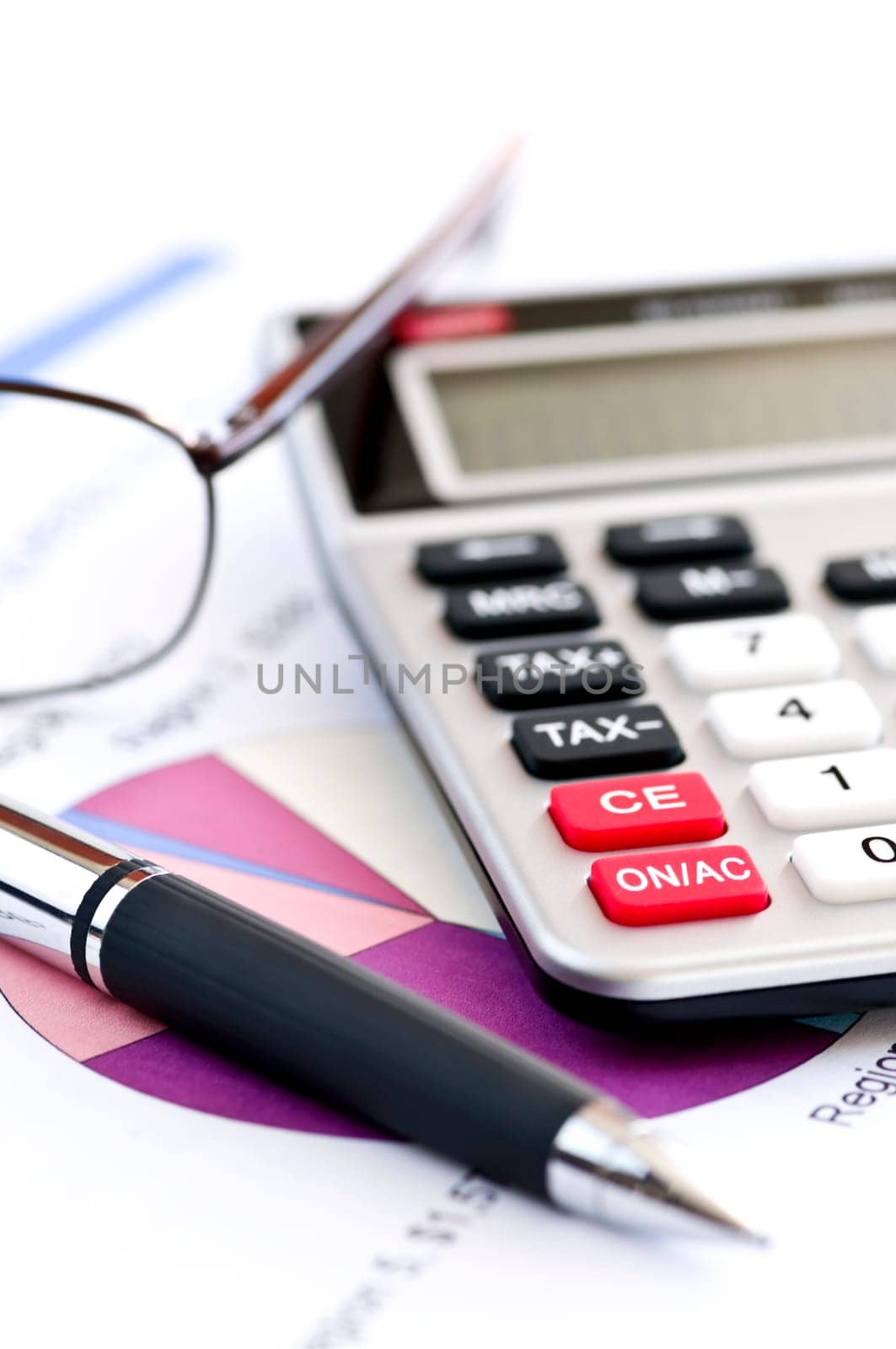 Tax calculator pen and glasses