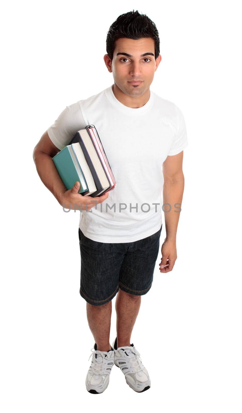 Male college student standing with textbooks under one arm
