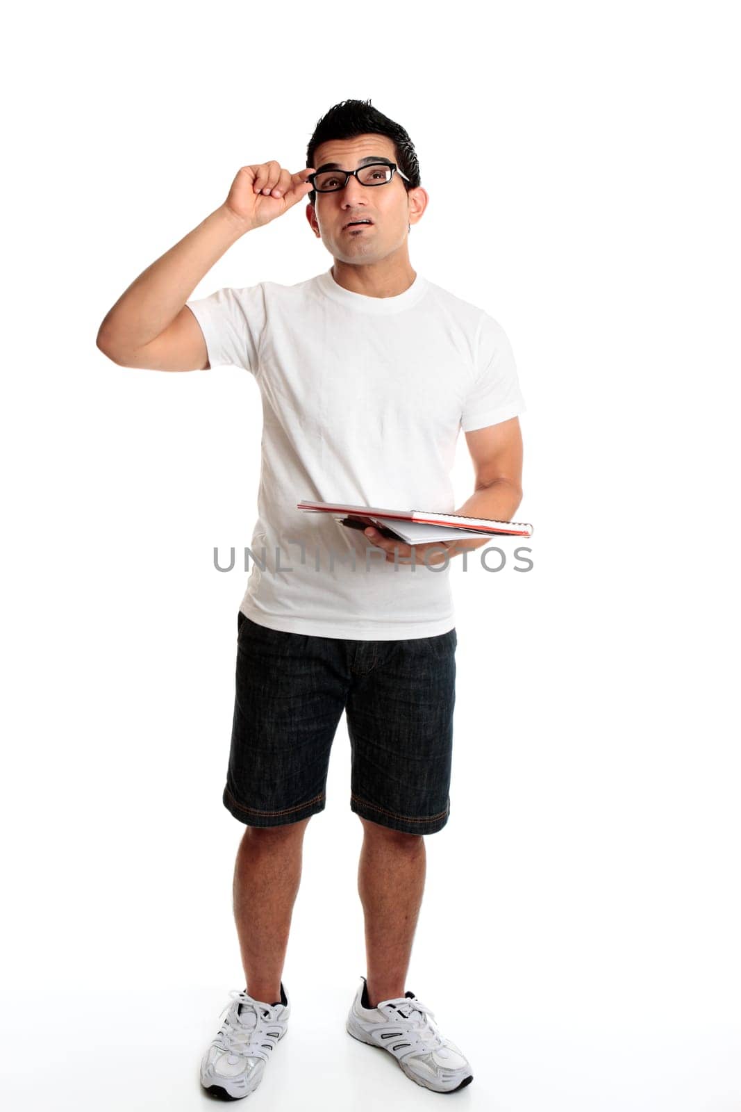 Man with a notepad and pen looking up
