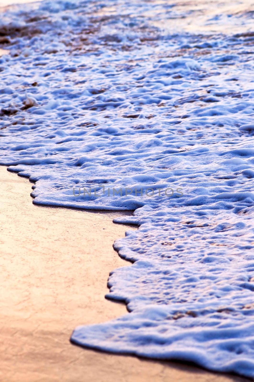 Waves breaking on tropical shore