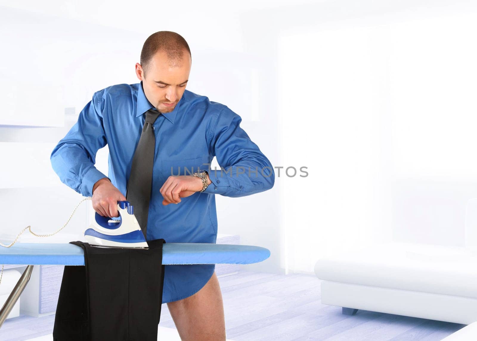 businessman hurry to ironing his trouser becose time to go work