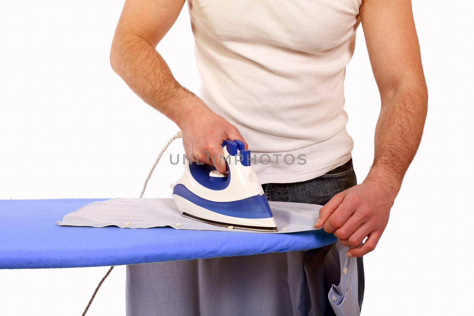 man ironing clothes