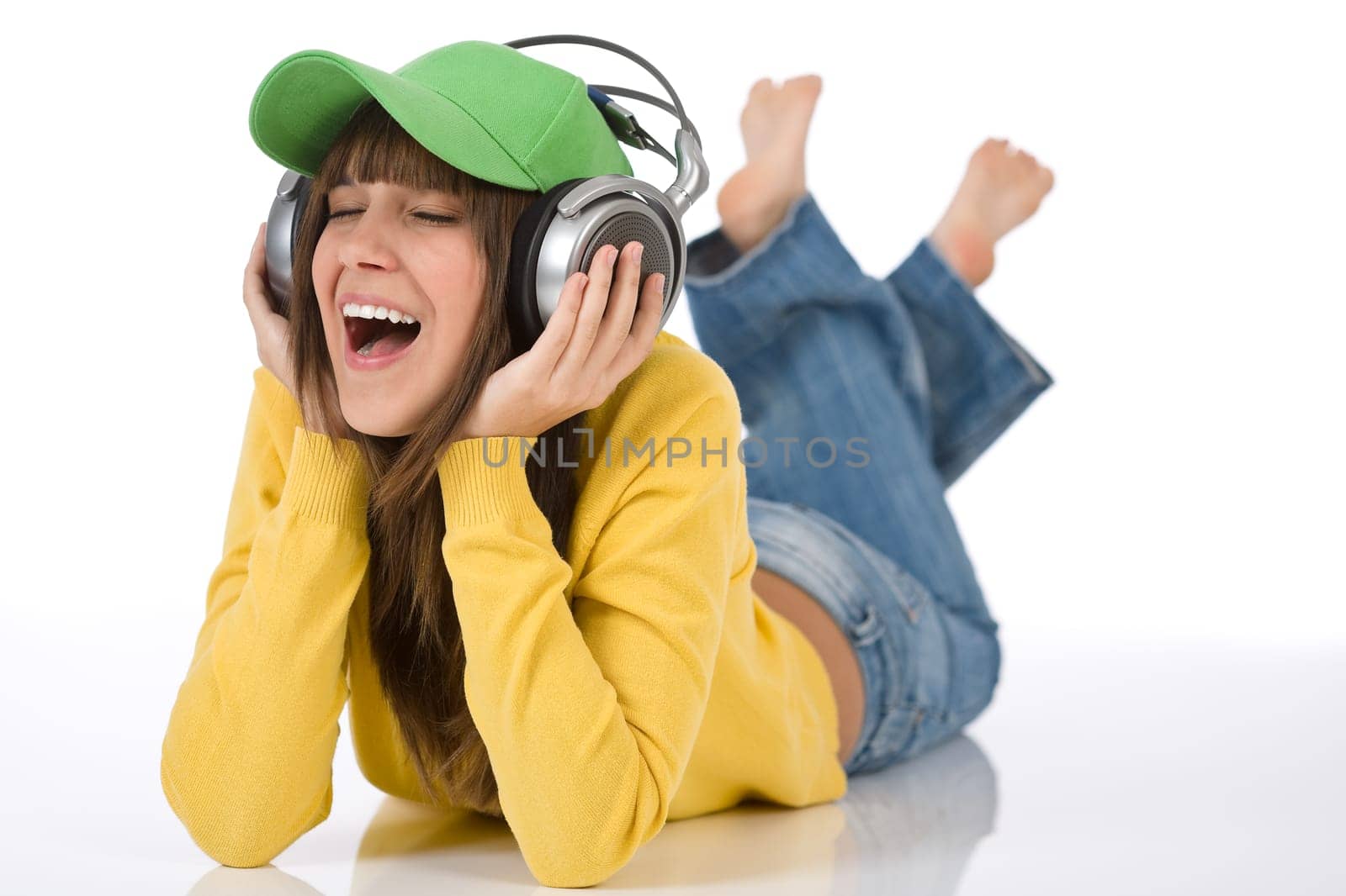 Happy female teenager enjoy music