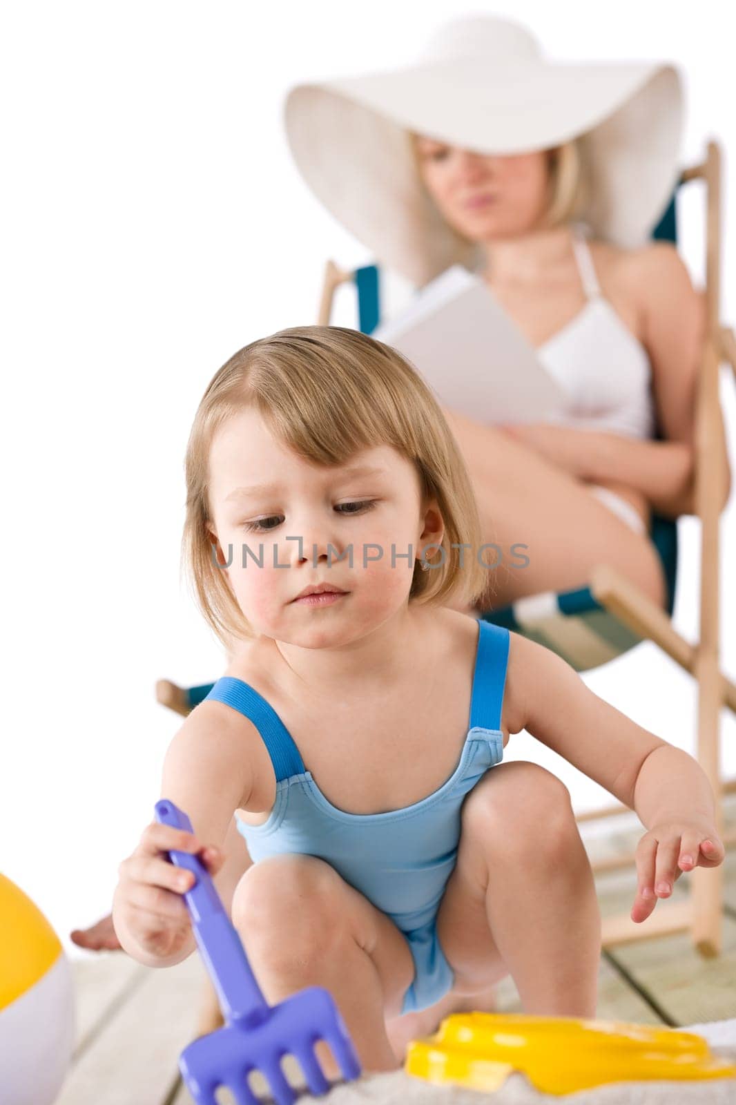 Beach - Young woman with child