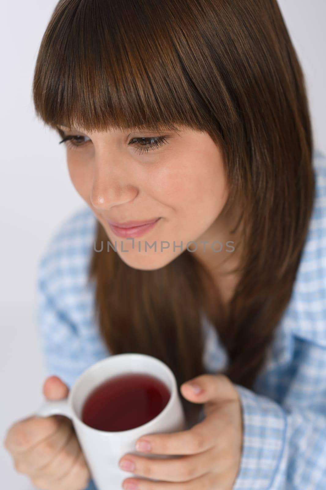Female teenager with cup of tea