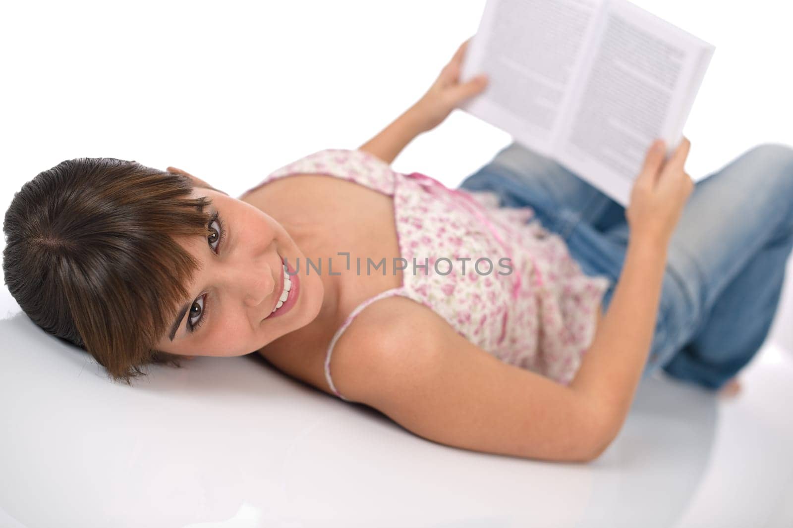 Happy female teenager with book