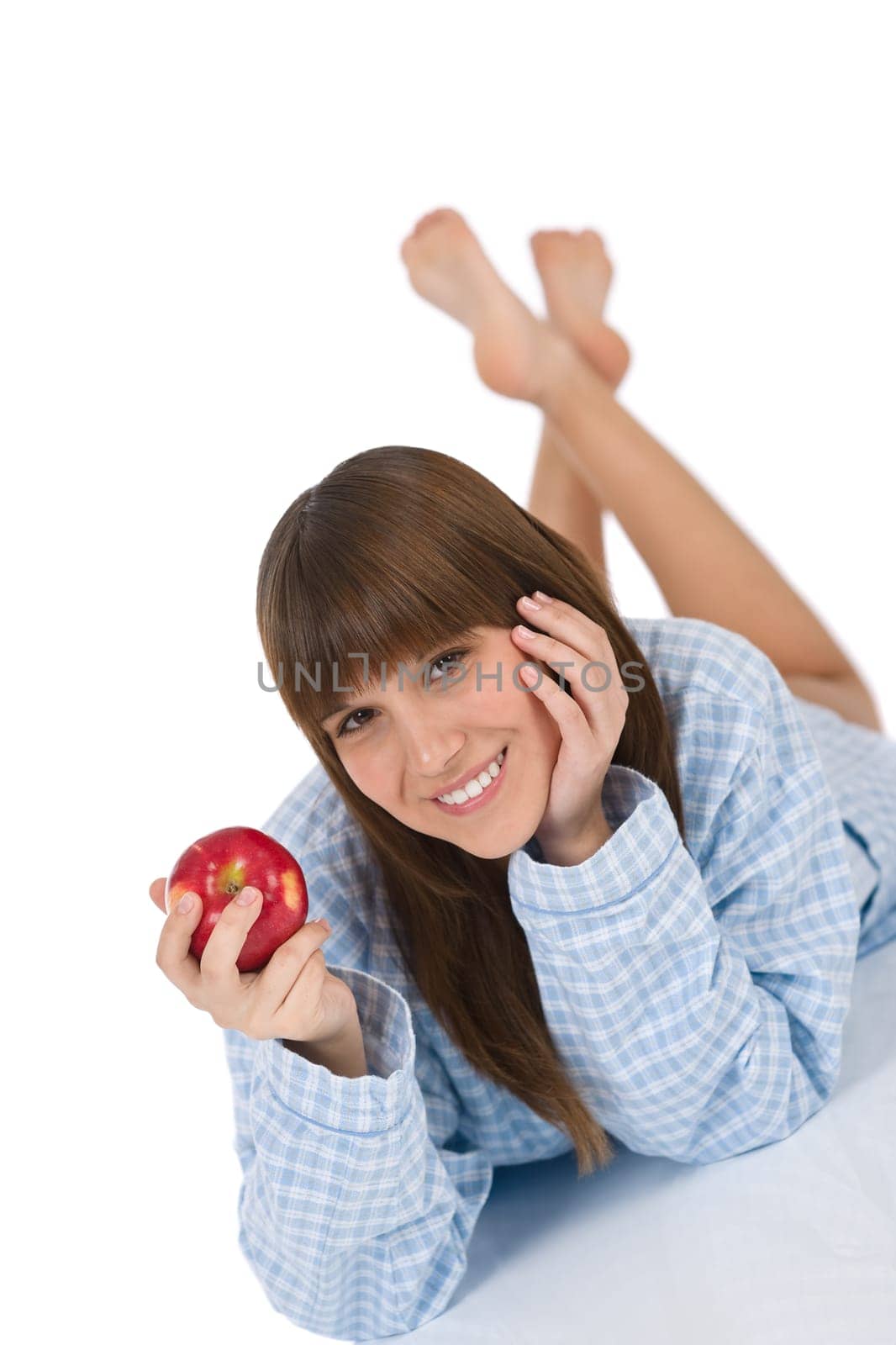 Happy teenager holding healthy apple