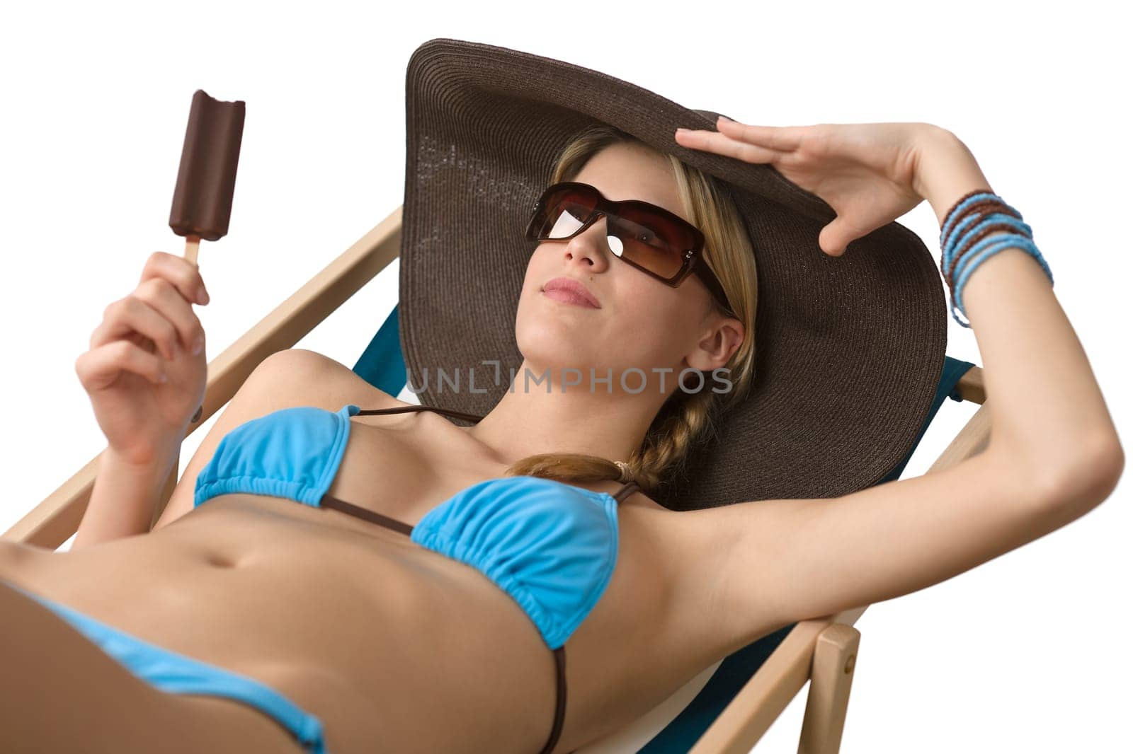 Young woman in bikini with ice-cream