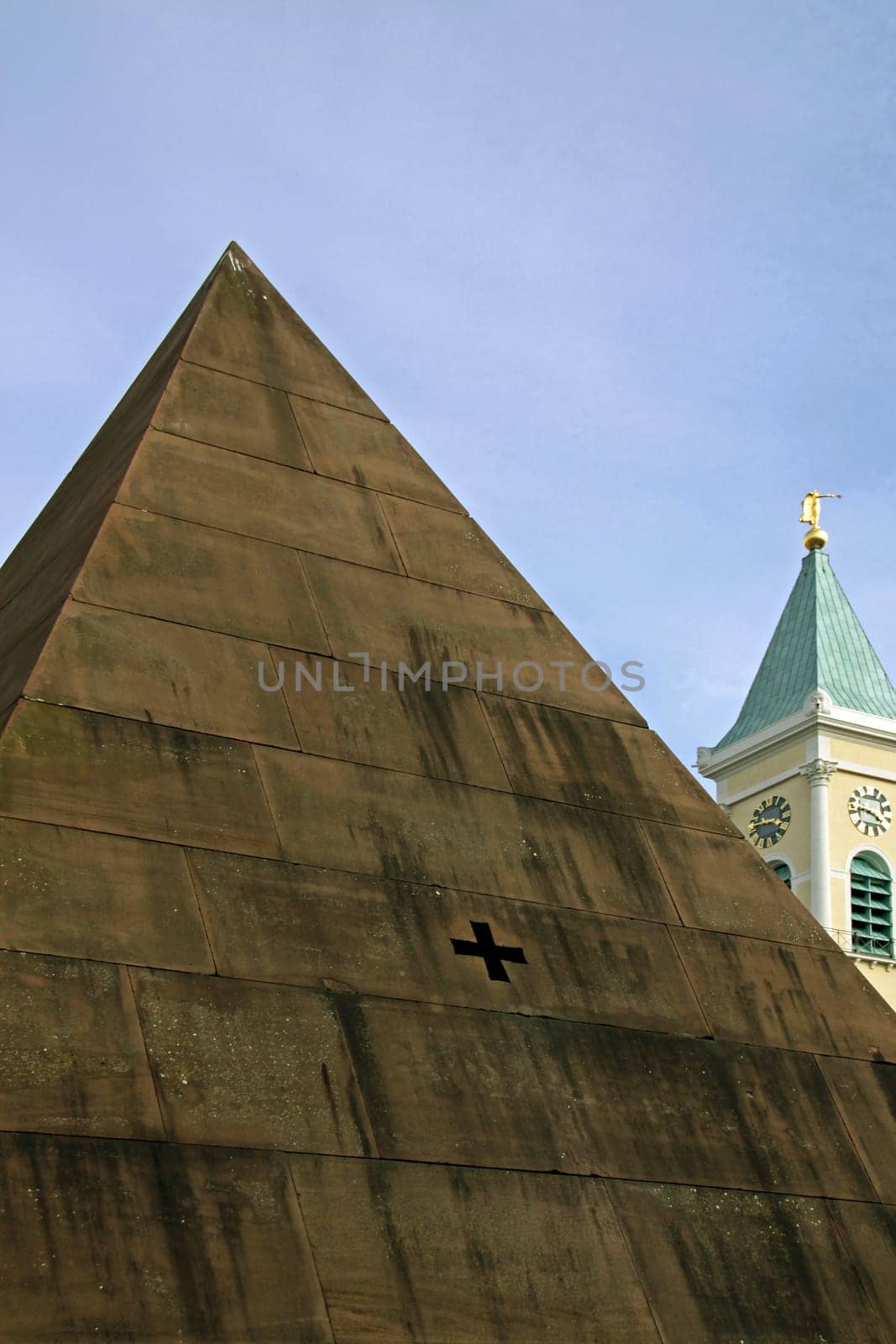 The pyramid on the market square between the town hall and the city church (pictured) is Karlsruhe's landmark.
