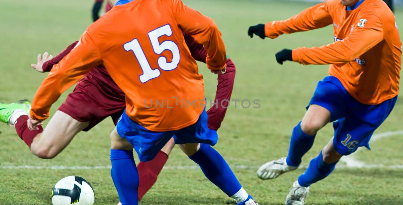 Soccer players fighting for the ball