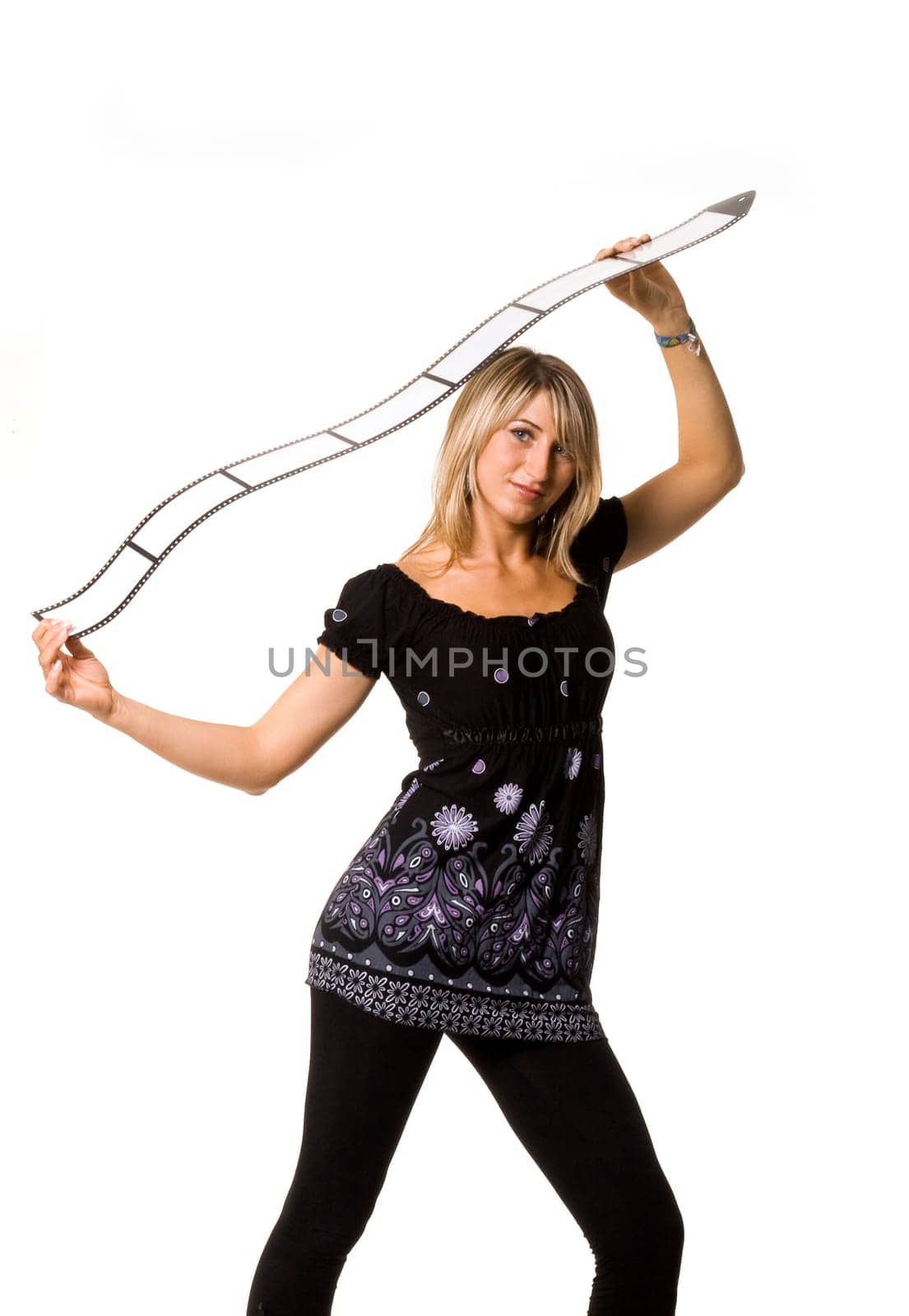 Sexy young woman folding film strip