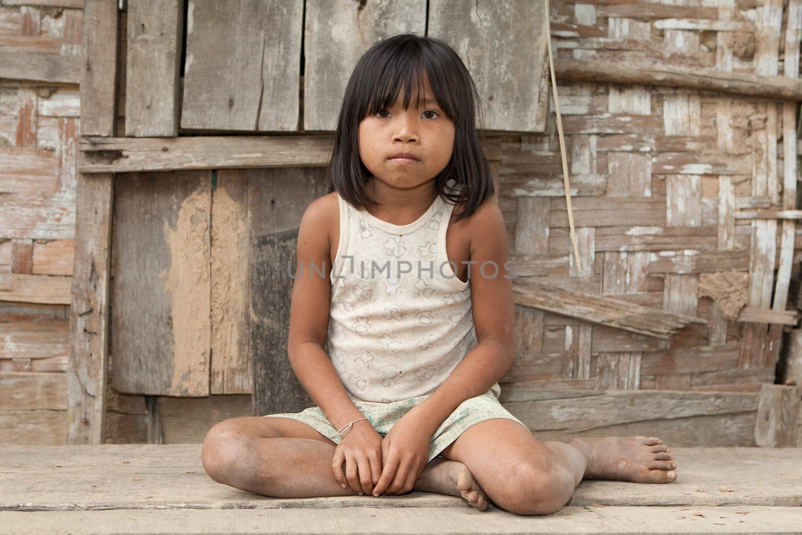 Portrait of girl from Laos in poverty