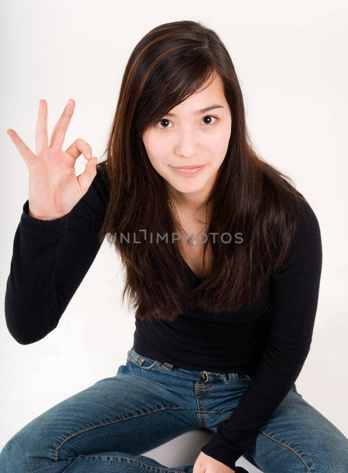 sitting with OK sign