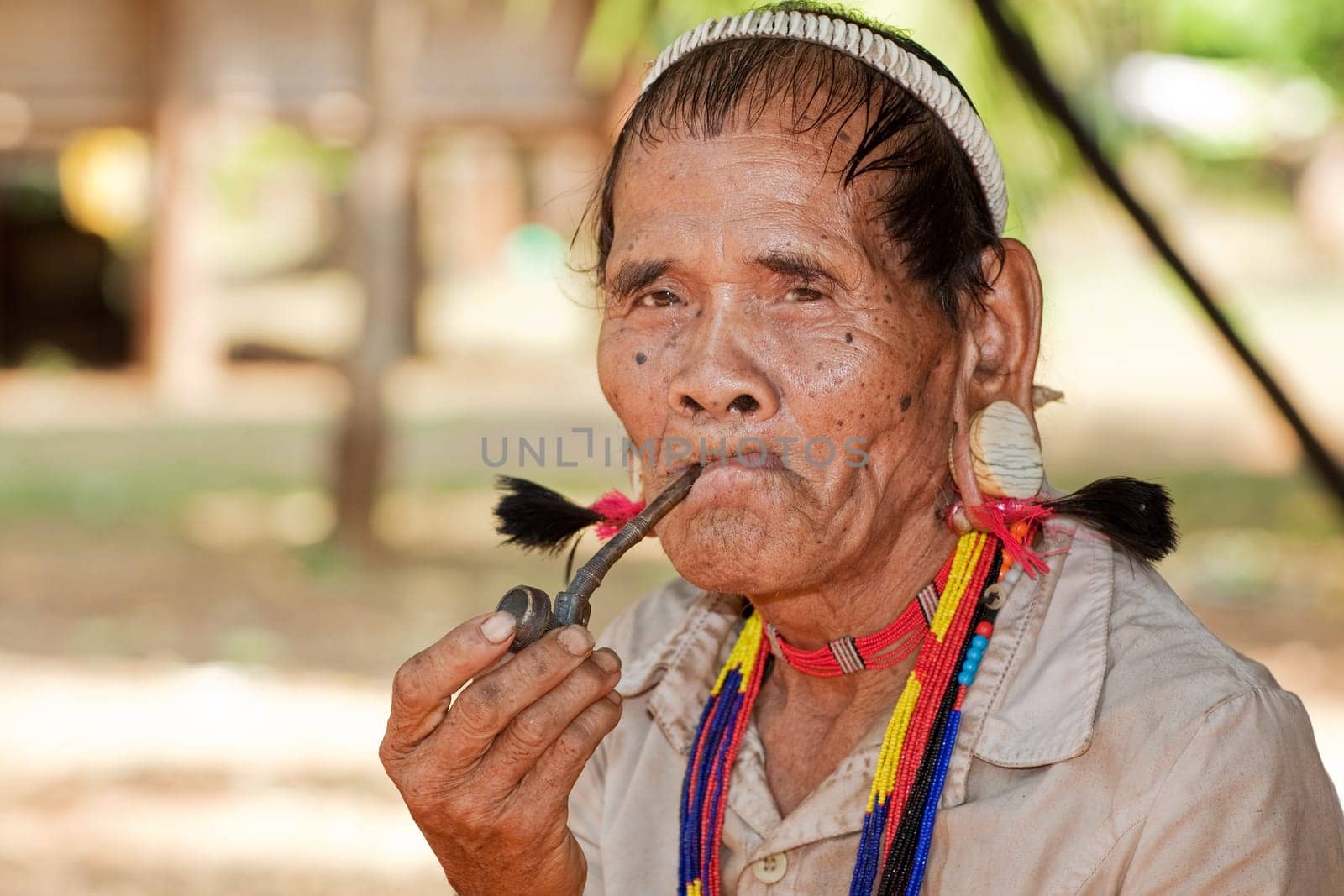 Portrait of old man with pipe