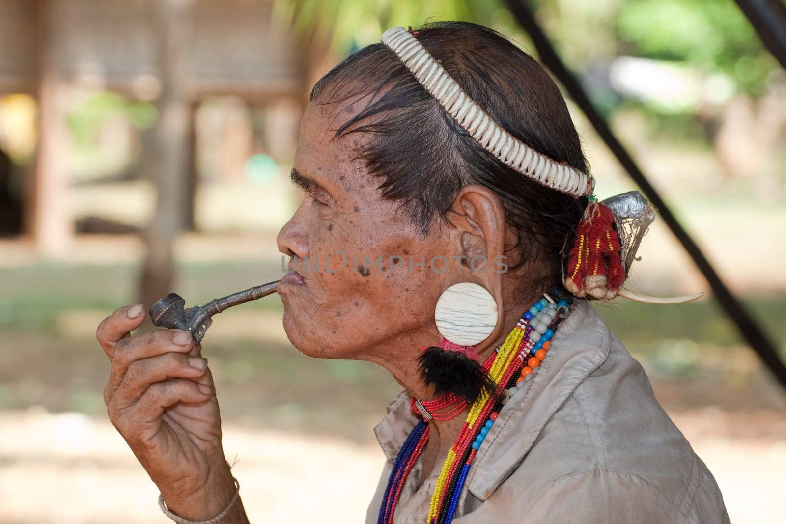 Portrait of old man with pipe