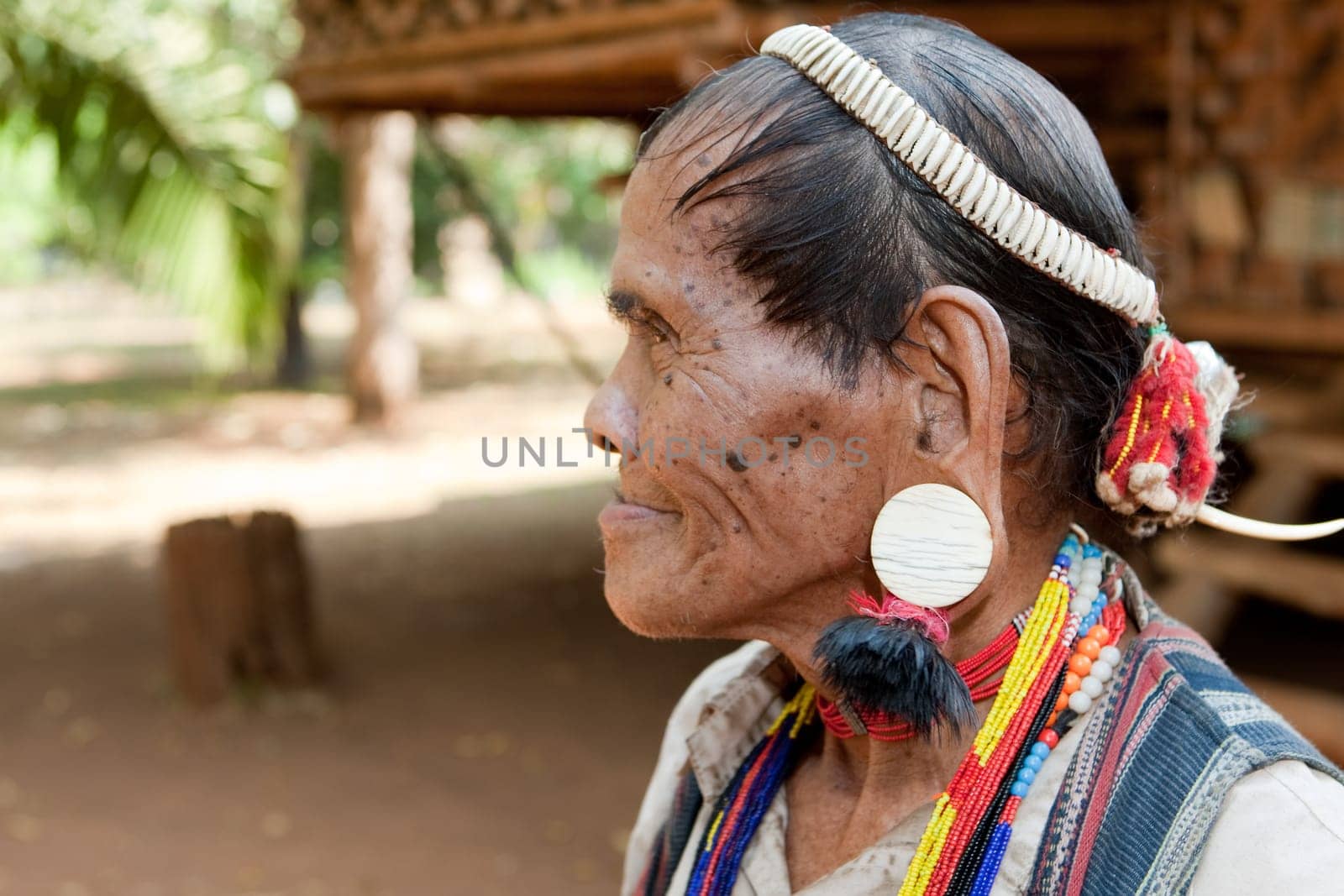 Portrait of old man with earrings
