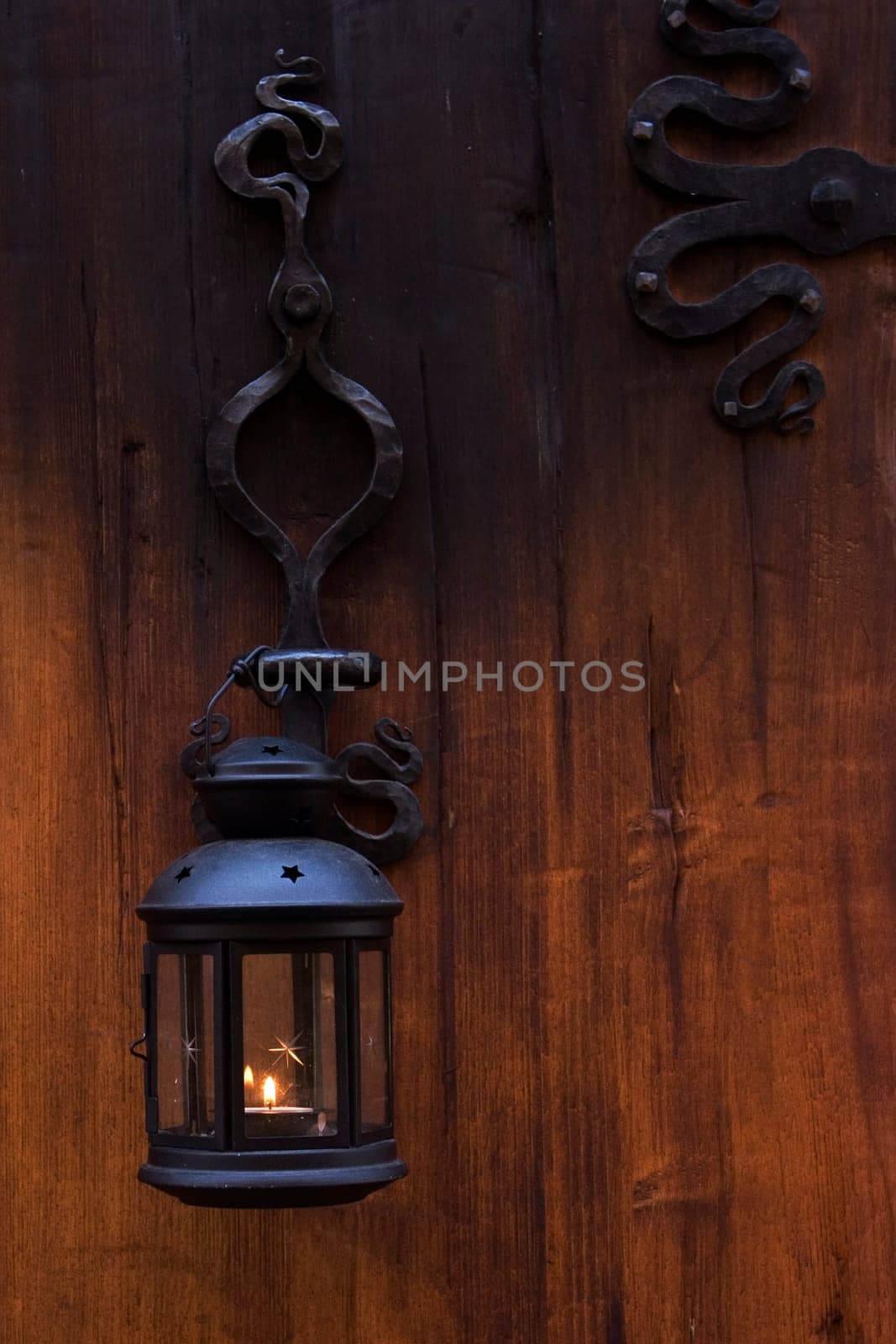 wood door with romantic iron lampe
