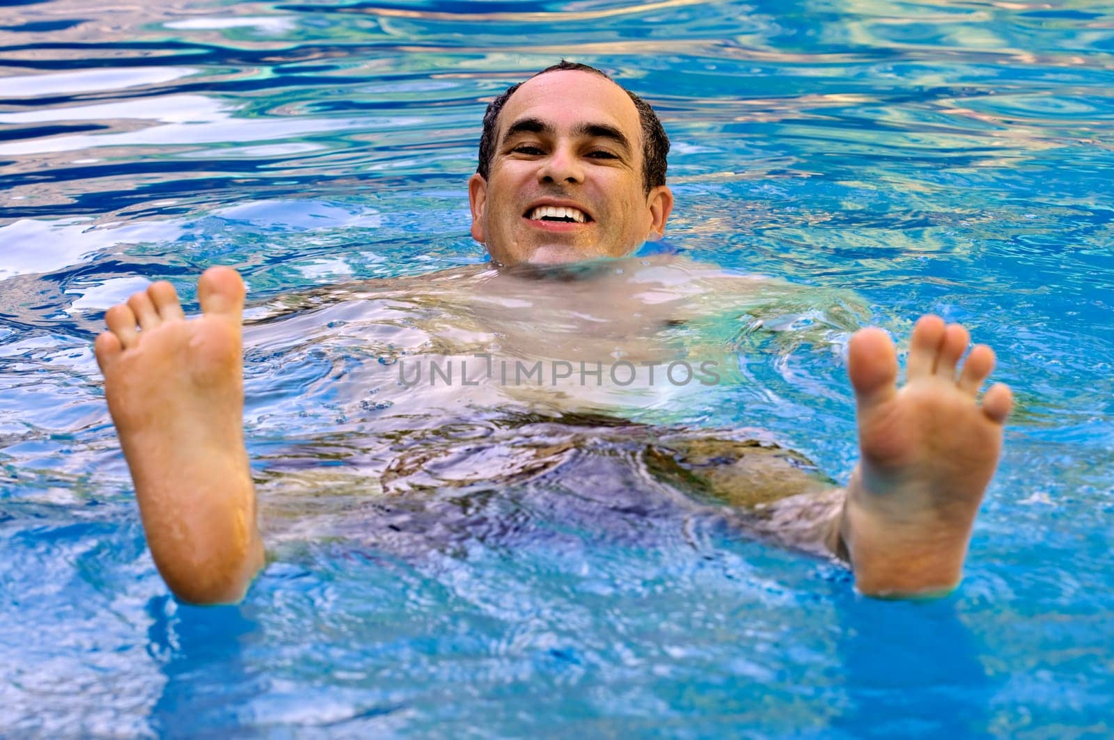 Man swimming in pool