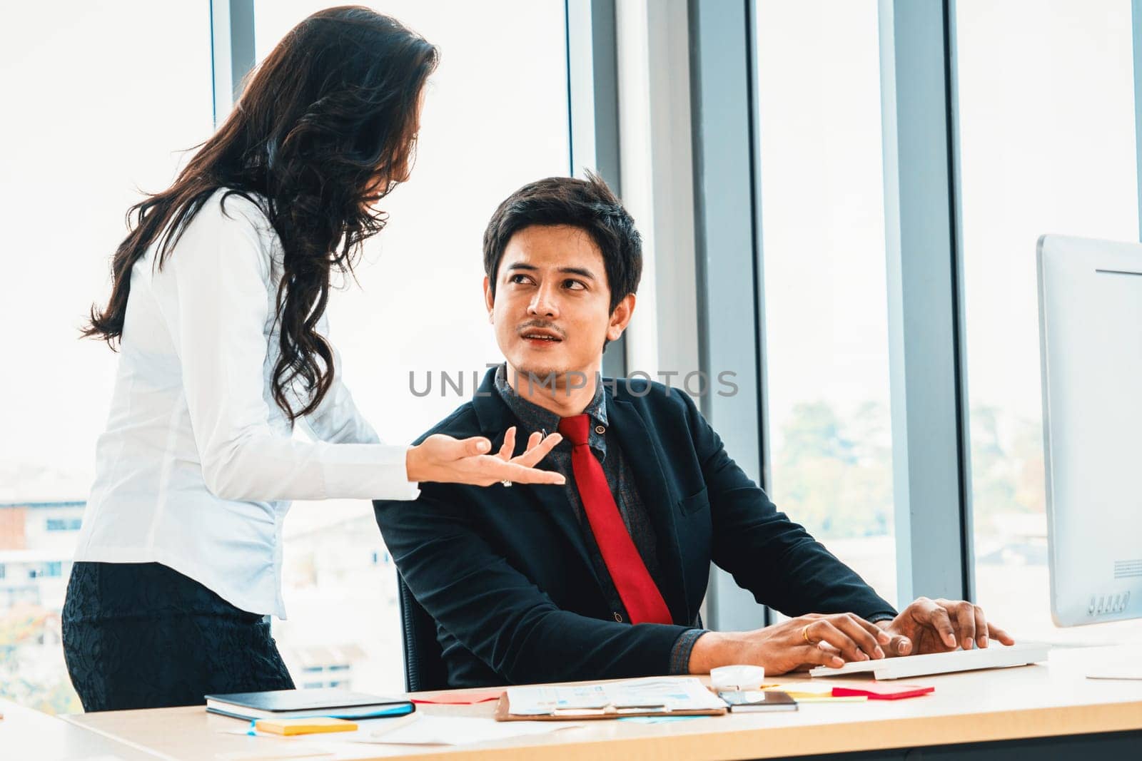 Two business people talk project strategy at office Jivy by biancoblue