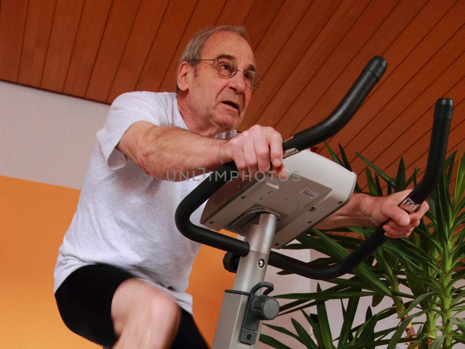 Senior on the exercise bike
