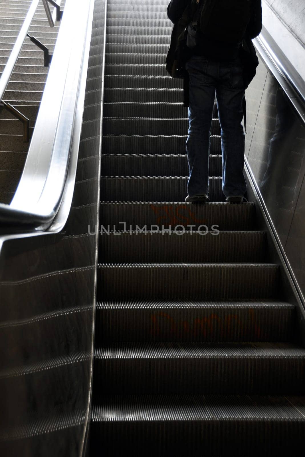 Man moving up with escalator