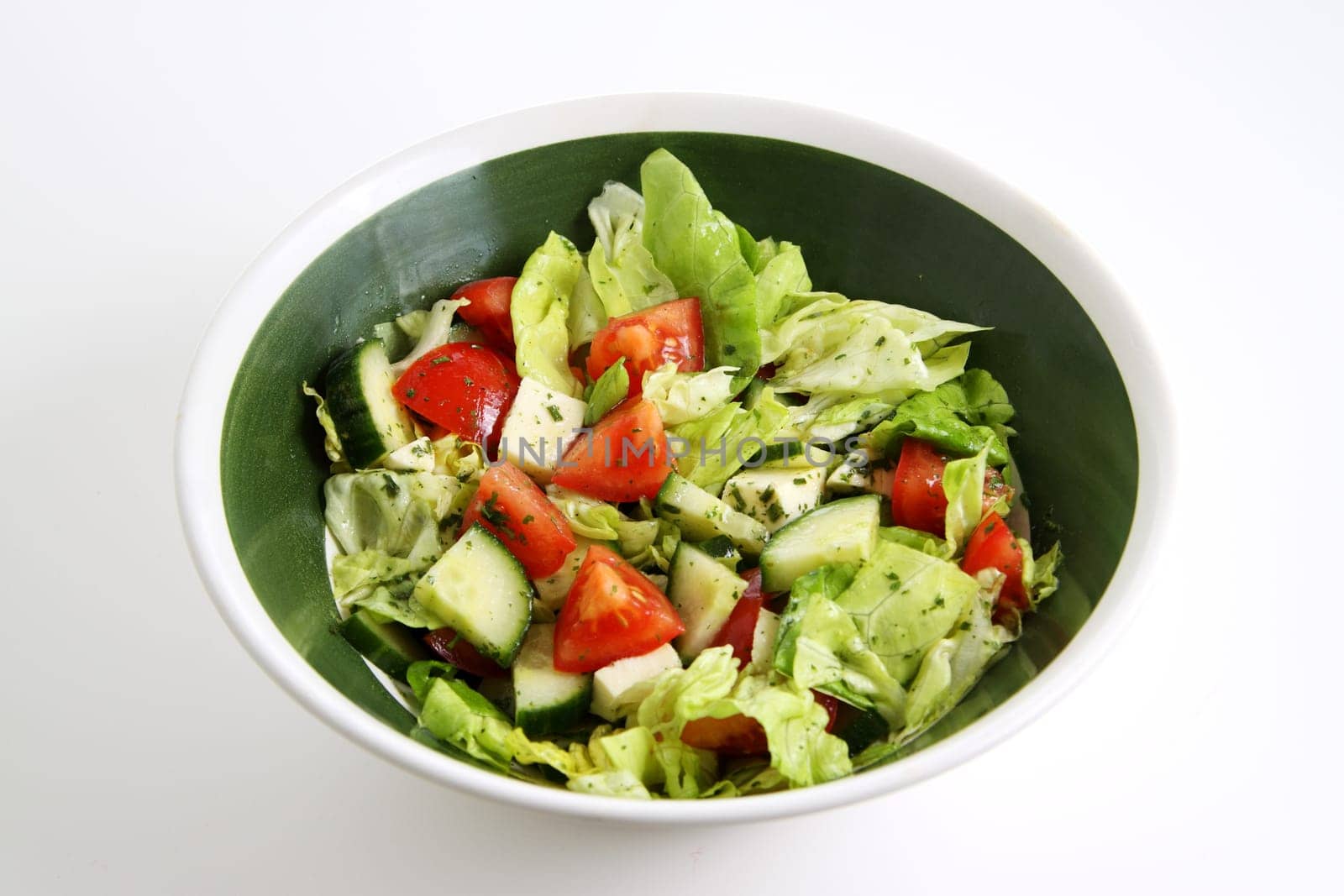 mixed green salad with tomato,cucumber and sheep's cheese