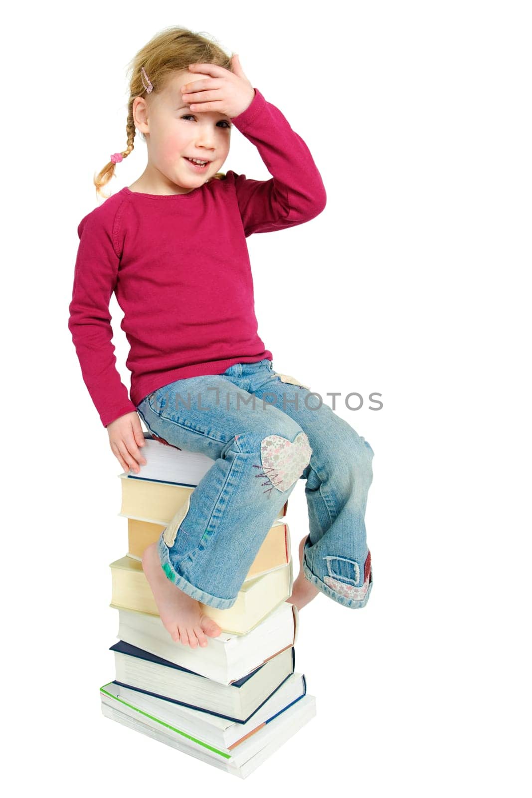 Child on a pile of books