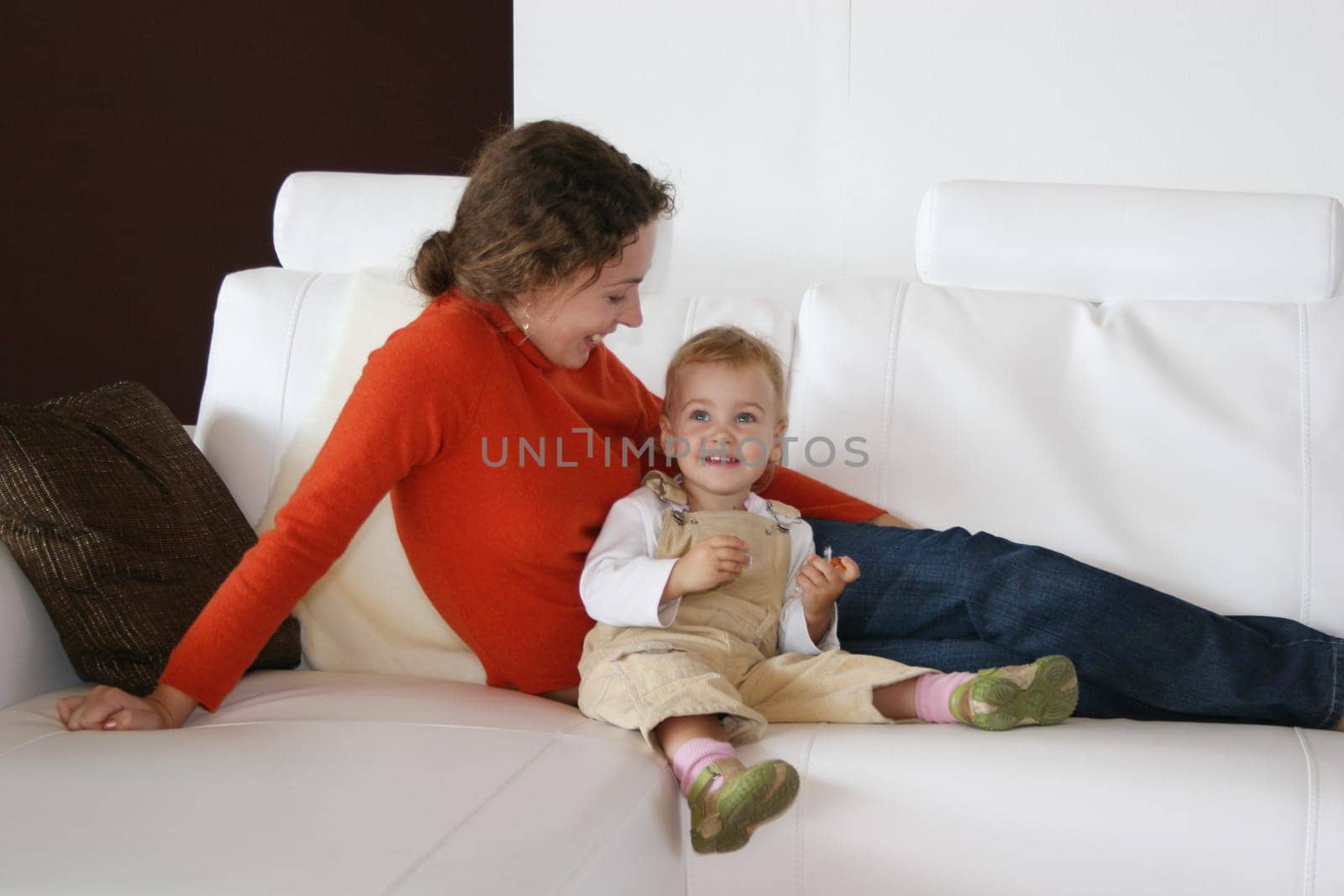 mother with baby on sofa