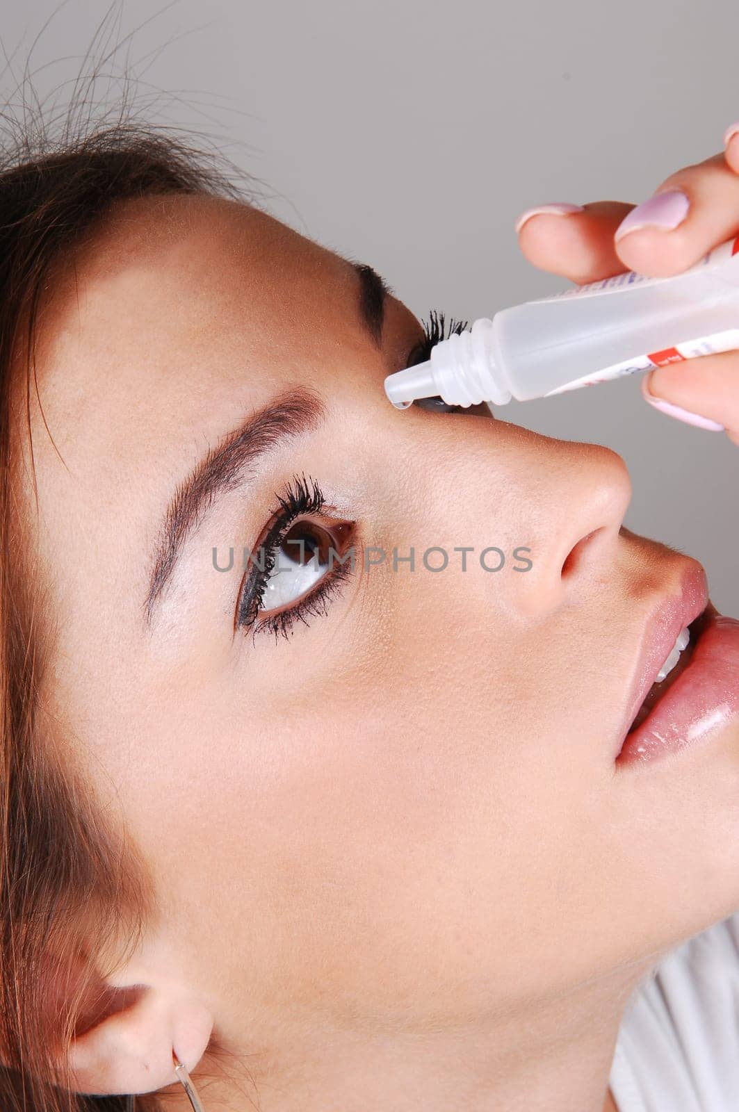 Woman with eyedrops.