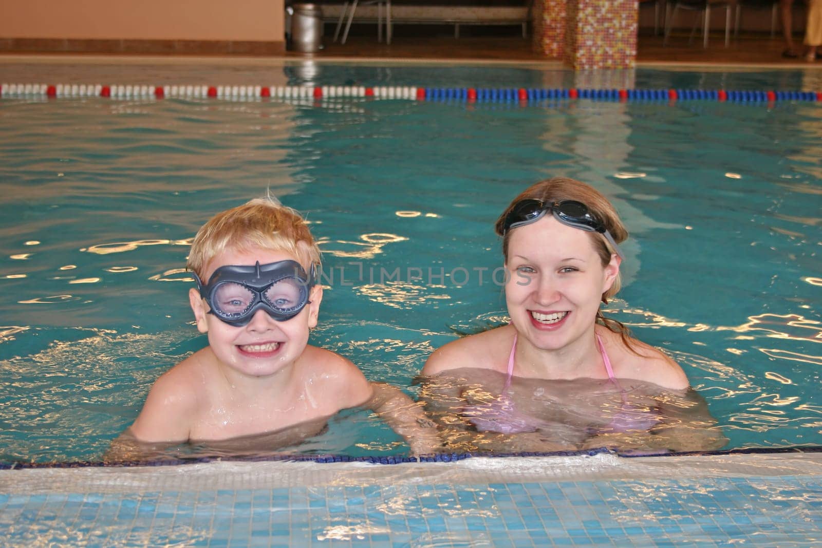 mother with child in covered pool