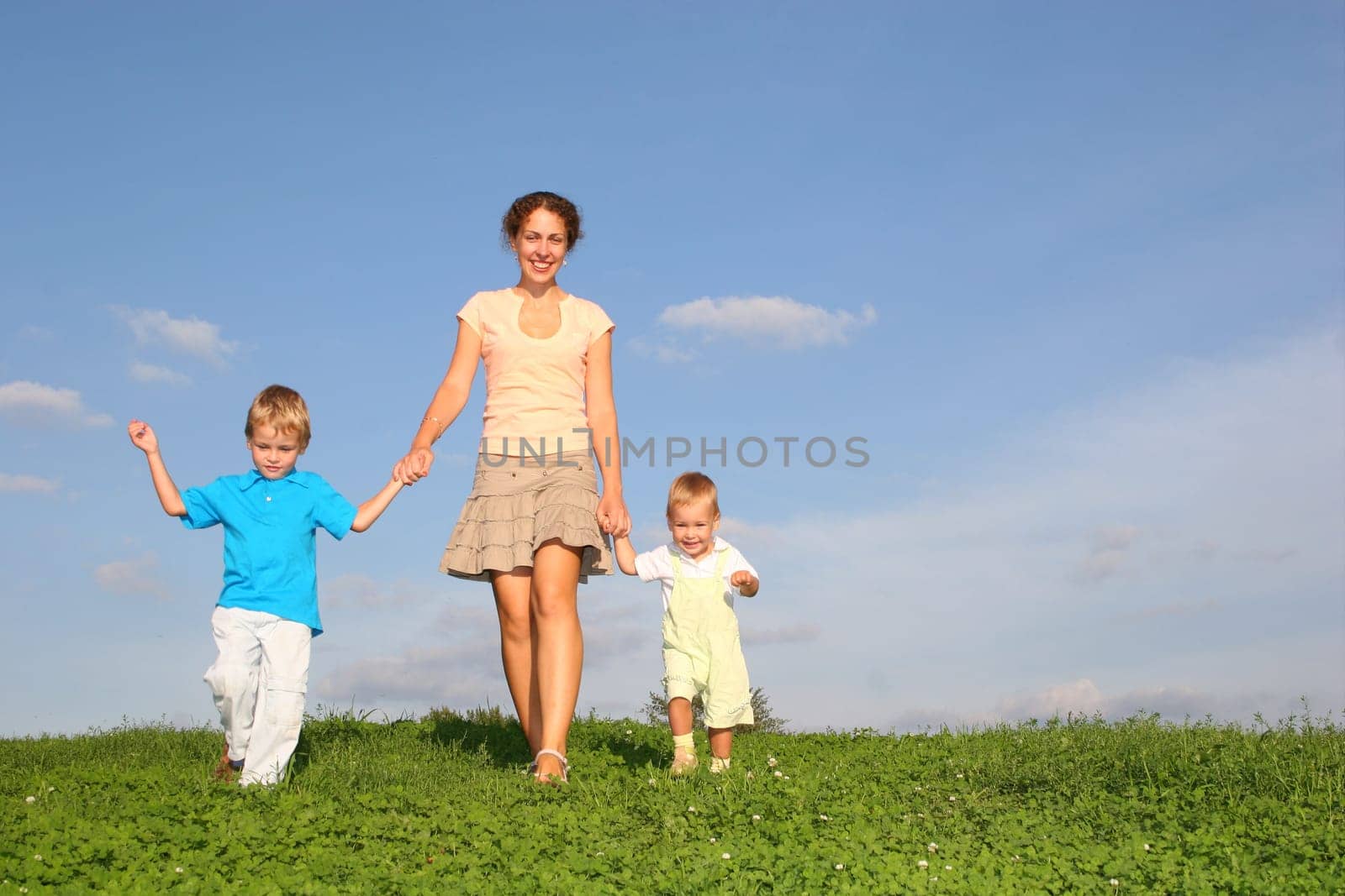 mother with children on meadow