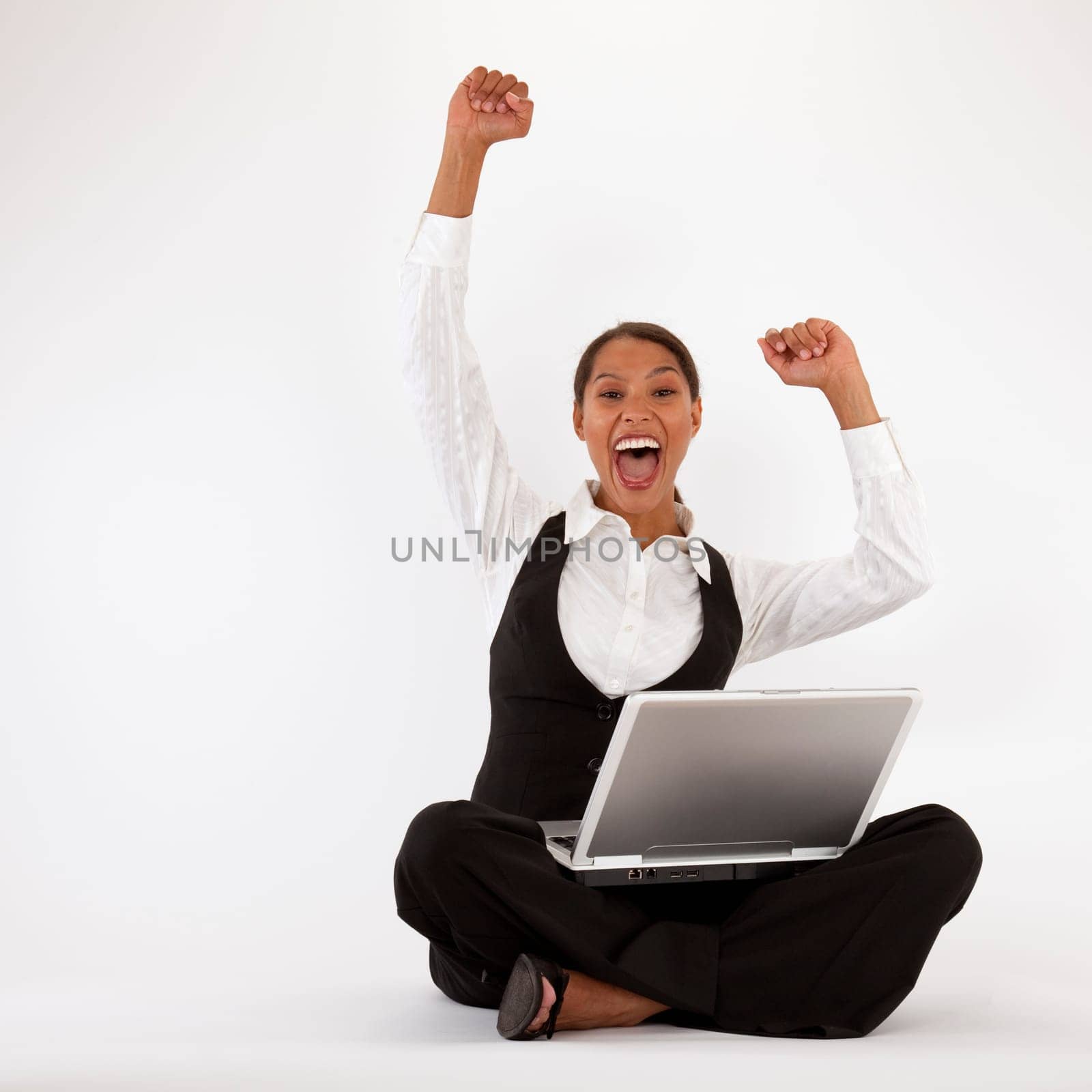 Young woman sitting on floor using laptop. Square format.