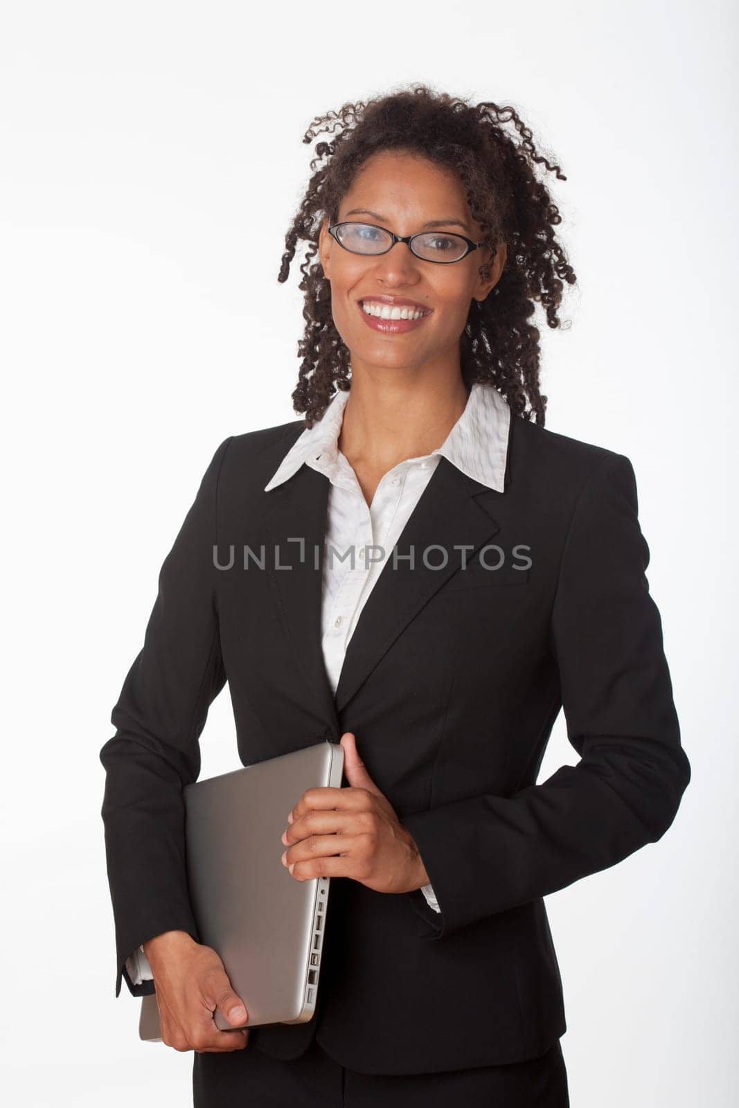 Young businesswoman holding laptop. Vertically framed shot.