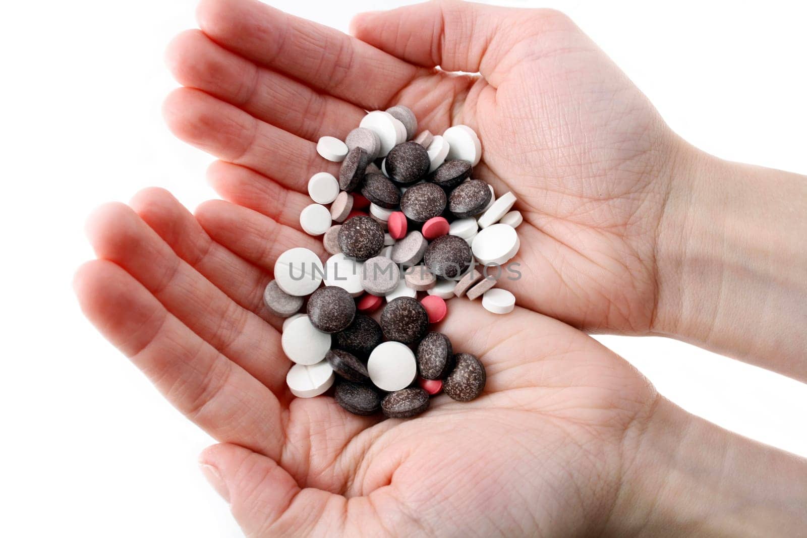 Hands with variety of pills