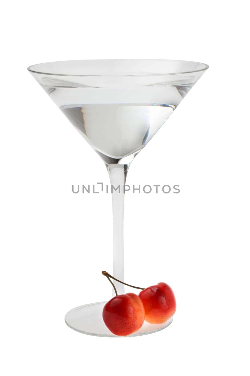 Martini mixed drink with cherry garnish on a white background
